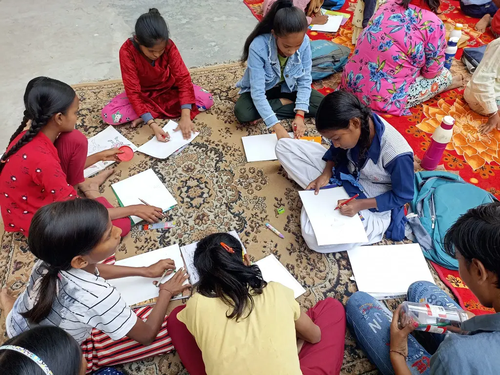 Girls taking part in a community learning activity